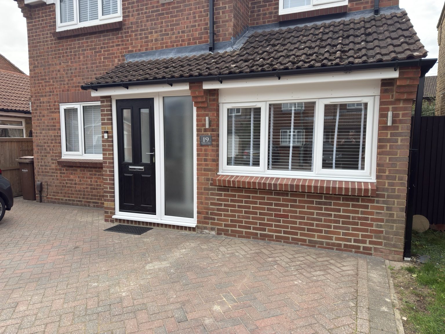 Finished brick exterior with new windows and entrance