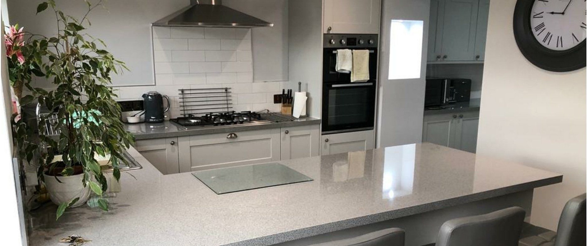 Completed kitchen with island and fitted units